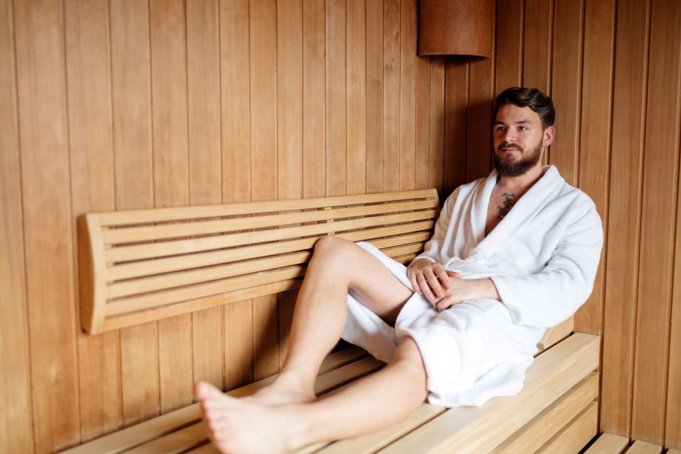 A man relaxing in the sauna to get steam for psoriasis