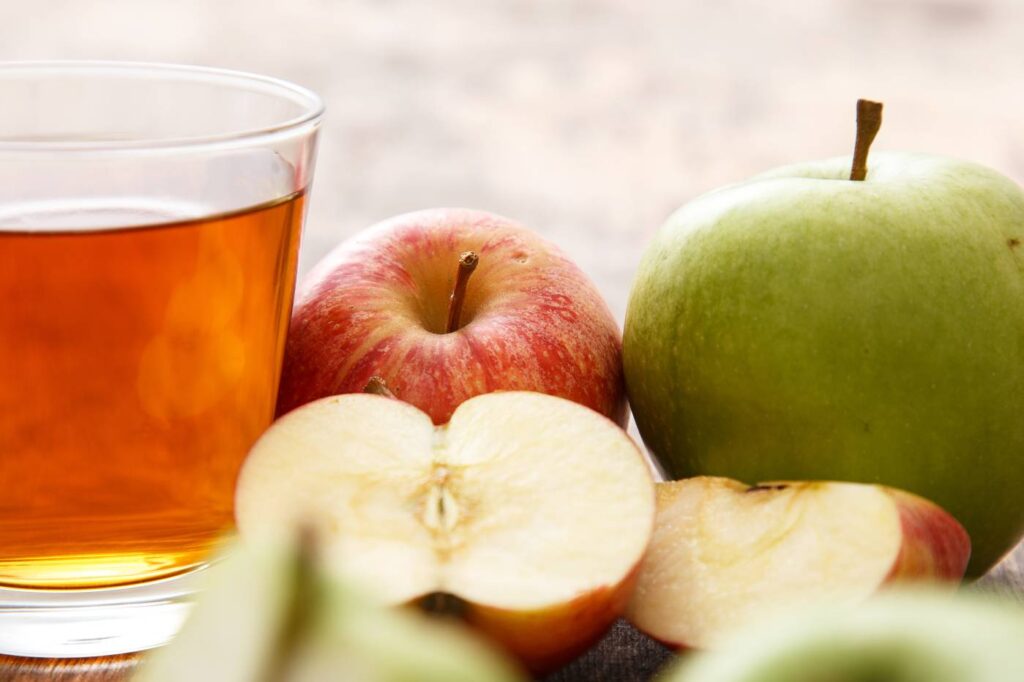 Apple and apple juice on a table